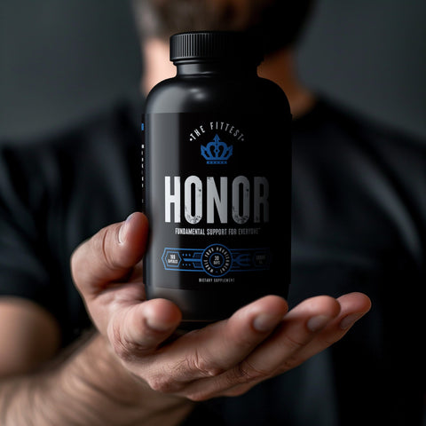 Man in a black shirt holding is hand out presenting a bottle of Armor