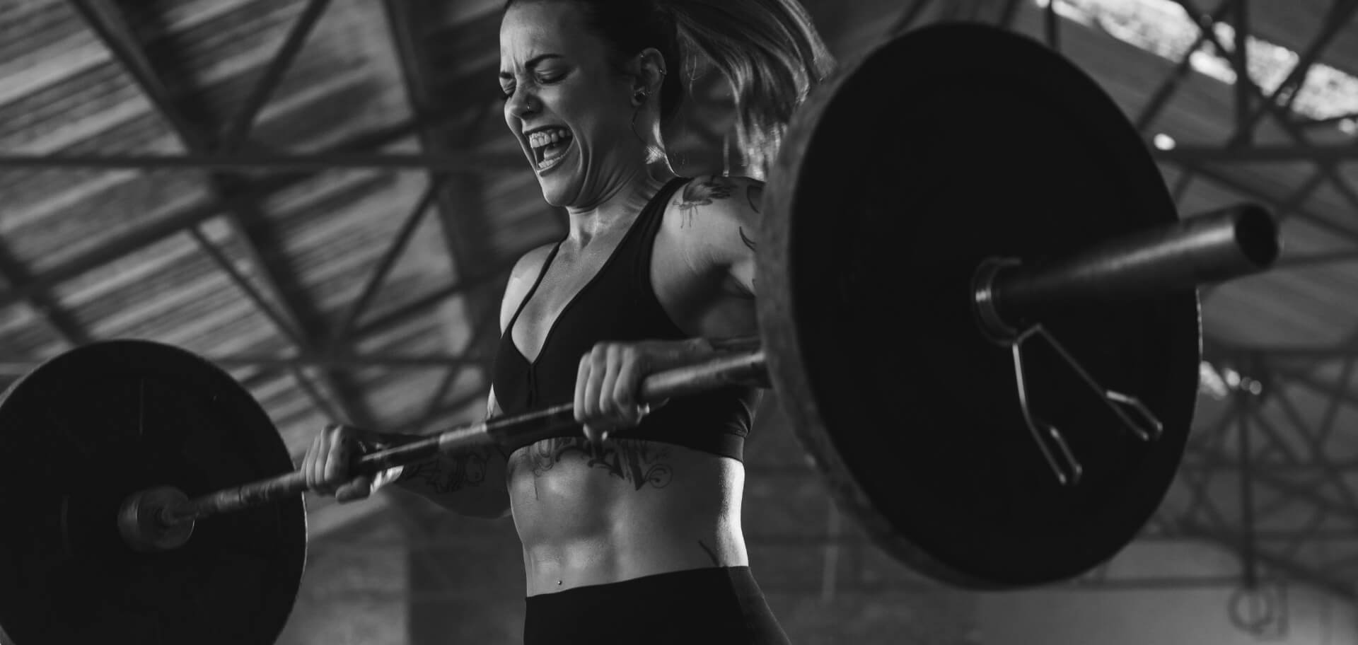 Lady lifting a barbell